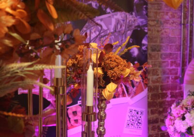 Wedding Night Market Liverpool wedding fair. A display from an event decorator and wedding planner with candles and autumnal leaves.